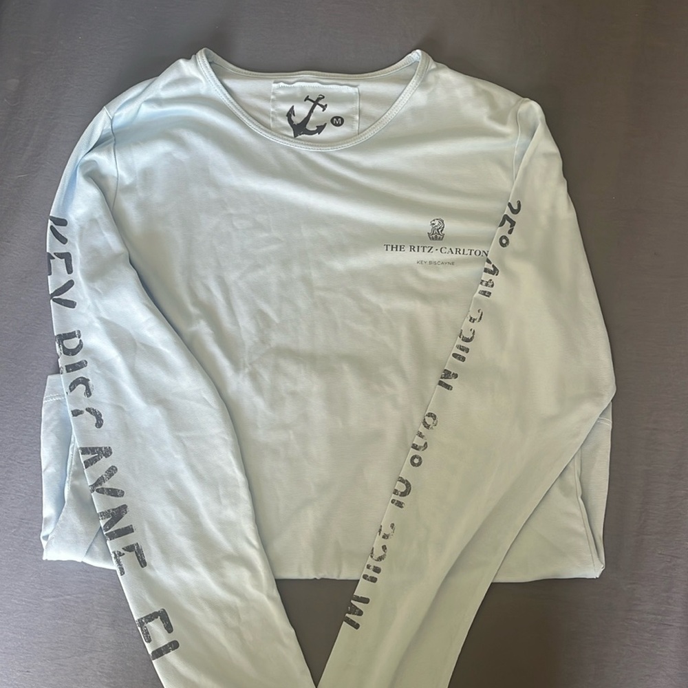 Women’s small baby blue swim shirt from Key Biscayne Ritz Carlton